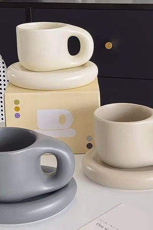 Pair of ceramic mugs on a marble counter