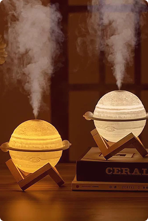 Reed diffuser lit on a bedside table
